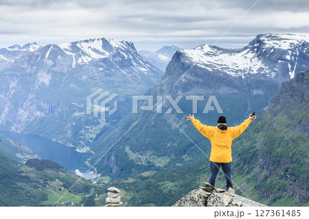 Tourist man on Dalsnibba viewpoint Norway Tourist man on Dalsnibba viewpoint Norway 127361485