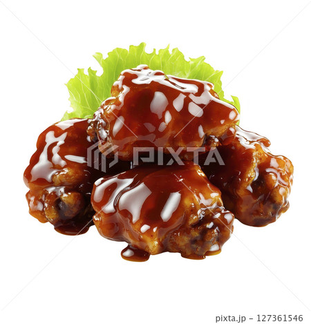 Juicy chicken wings coated in rich, glossy barbecue sauce are stacked on fresh lettuce leaf, creating mouthwatering and savory presentation 127361546