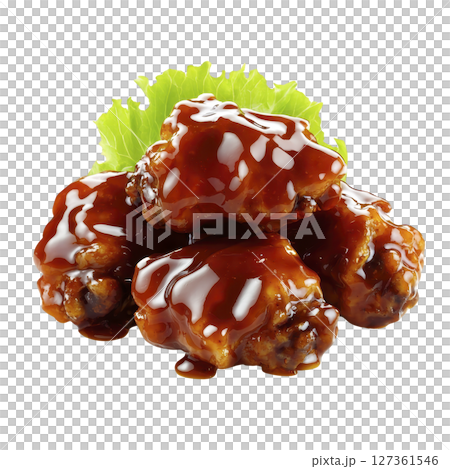 Juicy chicken wings coated in rich, glossy barbecue sauce are stacked on fresh lettuce leaf, creating mouthwatering and savory presentation 127361546