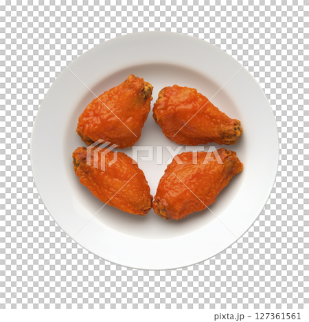 Four spicy buffalo chicken wings are arranged on white plate, showcasing their vibrant orange glaze. wings appear crispy and flavorful, perfect for savory snack or appetizer Four spicy buffalo chicken wings are arranged on white plate, showcasing their vibrant orange glaze. wings appear crispy and flavorful, perfect for savory snack or appetizer 127361561