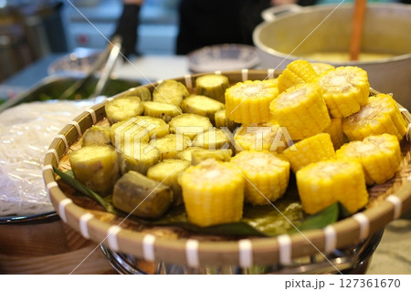 Corn pieces Steamed sweet potato or Shakhar Kandi in a plate. Steamed root sweet potato. Corn pieces Steamed sweet potato or Shakhar Kandi in a plate. Steamed root sweet potato. 127361670