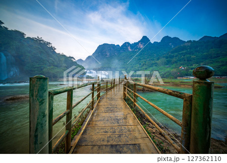 Bridge to Ban Gioc Waterfalls, a famous cross-border waterfall between Vietnam and China Bridge to Ban Gioc Waterfalls, a famous cross-border waterfall between Vietnam and China 127362110