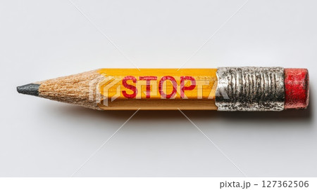 Close-Up of a Pencil With a Red Warning Sign 127362506