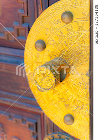 The lock on the gate. The lock on the gate. 127364188