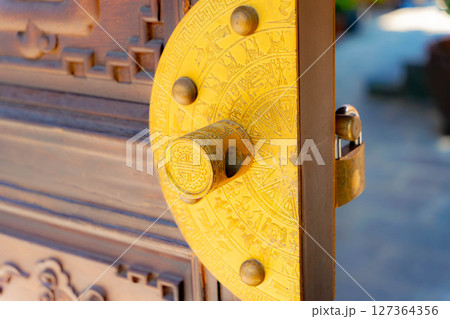 The lock on the gate. The lock on the gate. 127364356
