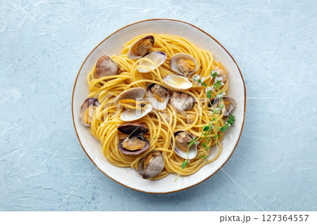 Vongole clams with spaghetti pasta, overhead flat lay shot. Seafood dish Vongole clams with spaghetti pasta, overhead flat lay shot. Seafood dish 127364557