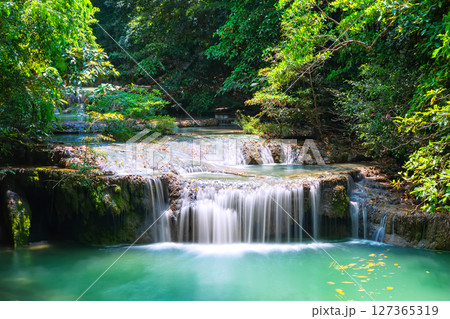Beautiful scenery of Erawan Waterfall in dense tropical jungle in Kanchanaburi National Park, Thailand. Beautiful scenery of Erawan Waterfall in dense tropical jungle in Kanchanaburi National Park, Thailand. 127365319
