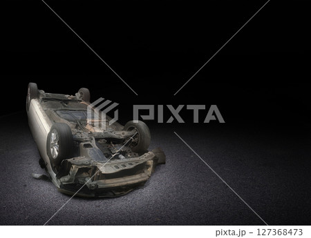 Car damaged after crashing and overturning on the road at night. Car accident. Car damaged after crashing and overturning on the road at night. Car accident. 127368473