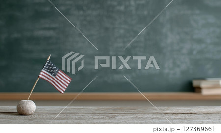 Small American flag on wooden table with chalkboard background for Labor Day celebration Small American flag on wooden table with chalkboard background for Labor Day celebration 127369661