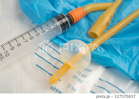 Foley catheter and urine drainage bag collect urine for disability or patient in hospital. Foley catheter and urine drainage bag collect urine for disability or patient in hospital. 127370837