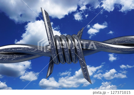 Barbed wire and sky in background - 3D illustration Barbed wire and sky in background - 3D illustration 127371015