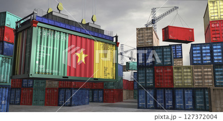 Cargo container with flag of Cameroon lifted by crane at freight terminal - 3D illustration 127372004
