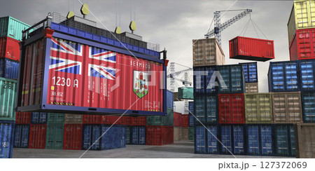 Cargo container with flag of Bermuda lifted by crane at freight terminal - 3D illustration Cargo container with flag of Bermuda lifted by crane at freight terminal - 3D illustration 127372069