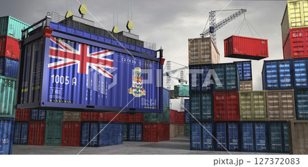 Cargo container with flag of Cayman Islands lifted by crane at freight terminal - 3D illustration 127372083