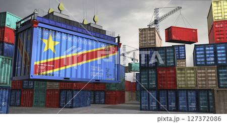 Cargo container with flag of Democratic Republic of the Congo lifted by crane at freight terminal - 3D illustration 127372086