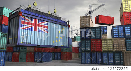 Cargo container with flag of Tuvalu lifted by crane at freight terminal - 3D illustration Cargo container with flag of Tuvalu lifted by crane at freight terminal - 3D illustration 127372235