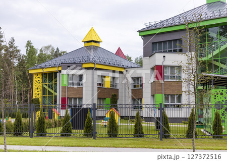 Children's playground in a kindergarten or park. Bright modern outdoor play equipment for children. 127372516