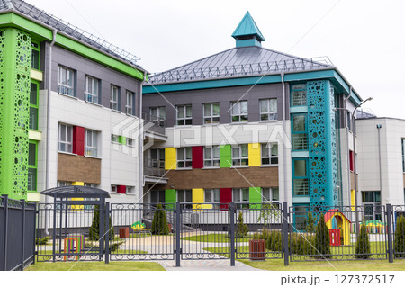 Children's playground in a kindergarten or park. Bright modern outdoor play equipment for children. 127372517