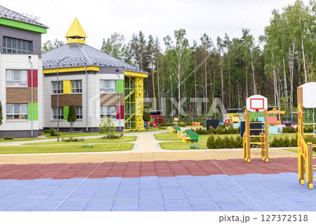 Children's playground in a kindergarten or park. Bright modern outdoor play equipment for children. 127372518