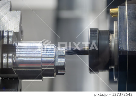 The CNC lathe machine milling process on metal shaft parts by flat nose end mill tool. 127372542