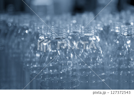 The group of drinking water bottles in the light blue scene. 127372543