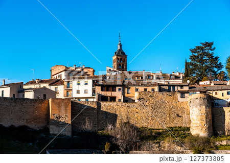 Picturesque Segovia cityscape under a bright blue sky. 127373805