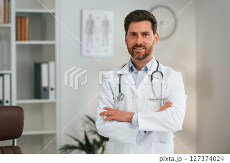 In the cabinet. Doctor in formal clothes is working In the cabinet. Doctor in formal clothes is working 127374024