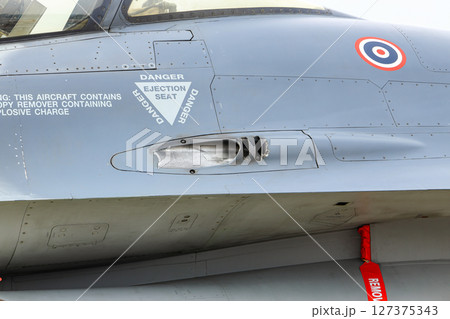 inset trailing vents of 20 mm M61 Vulcan cannon on General Dynamics F-16 Fighting Falcon aircraft. 127375343