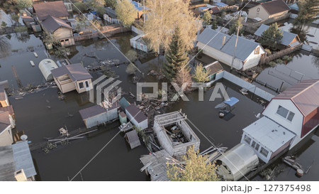 Floods on the planet, global warming. Climate change,natural disastersthe riot of nature. The apocalypse, catastrophes.Storms and destruction.The remnants of human life are floating in dirty water.End 127375498