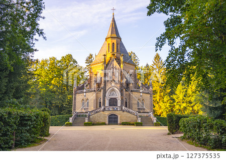 Schwarzenberg Tomb is a striking neo-Gothic structure located in Domanin, Czechia, surrounded by lush greenery and set against a tranquil sky, offering a peaceful atmosphere for visitors. Schwarzenberg Tomb is a striking neo-Gothic structure located in Domanin, Czechia, surrounded by lush greenery and set against a tranquil sky, offering a peaceful atmosphere for visitors. 127375535