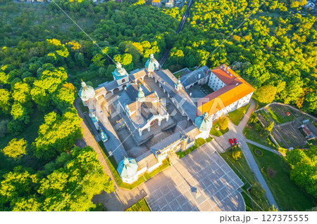 Holy Mountain in Pribram is an iconic Baroque complex in Czechia, attracting pilgrims and visitors alike. Surrounded by lush greenery, it showcases stunning architecture and serene landscapes. 127375555