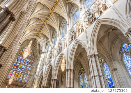 Discover the intricate gothic architecture of Westminster Abbey, featuring stunning arches, detailed stained glass windows, and splendid chandeliers that illuminate the historic interior. Discover the intricate gothic architecture of Westminster Abbey, featuring stunning arches, detailed stained glass windows, and splendid chandeliers that illuminate the historic interior. 127375563