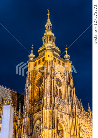 St Vitus Cathedral in Prague Castle is beautifully illuminated under a night sky, showcasing its stunning architecture and intricate details. 127375573
