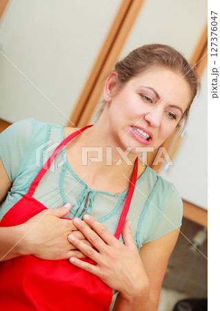 Woman suffering from having heart attack. Woman suffering from having heart attack. 127376047