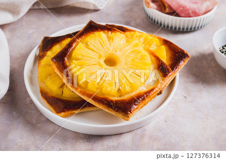Sweet homemade pineapple tarts on a plate on the table Sweet homemade pineapple tarts on a plate on the table 127376314