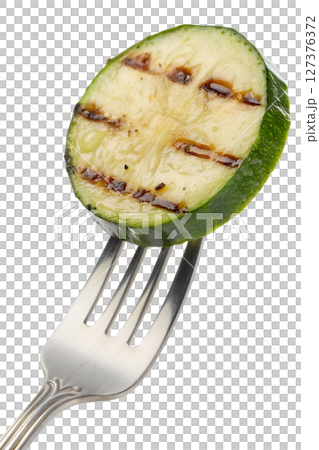Grilled zucchini slice on fork isolated, healthy summer vegetable dish, low-carb food concept 127376372