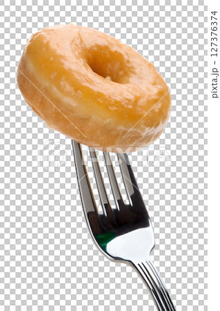 Glazed donut on fork isolated, sweet pastry dessert, sugar icing drip 127376374