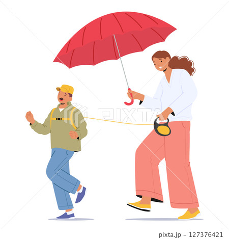 Overprotective mother walking with son holding child on leash controlling activity outdoors 127376421