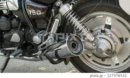 Chrome Exhaust and Rear Wheel on Vintage Motorcycle 127376532