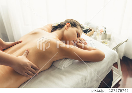 Caucasian woman customer enjoying relaxing anti-stress massage. Quiescent Caucasian woman customer enjoying relaxing anti-stress massage. Quiescent 127376743