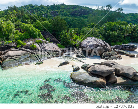 Tropical beach with palm trees. Seychelles, Mahe. Baie Lazare Beach. 127376835