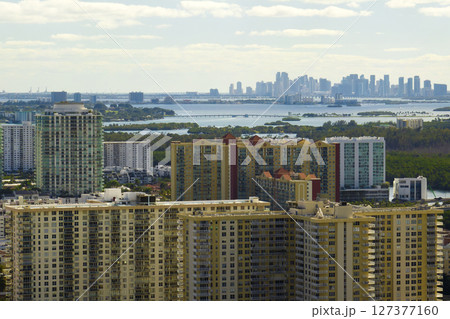 View from above of luxurious highrise hotels and condos on Atlantic ocean shore in Sunny Isles Beach city. American tourism infrastructure in southern Florida 127377160