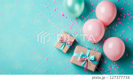 Joyful gifts and balloons set against a radiant turquoise backdrop with copyspace 127377738