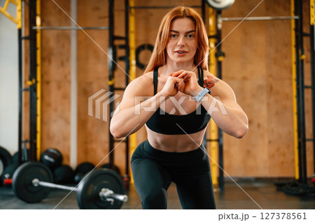 Warm up exercises. Beautiful strong woman is in the gym Warm up exercises. Beautiful strong woman is in the gym 127378561