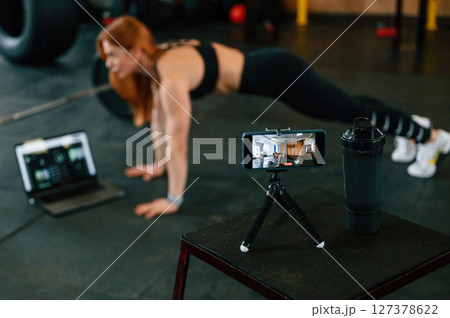 Beautiful strong woman is in the gym 127378622