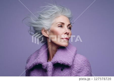 A woman with a purple coat and long hair A woman with a purple coat and long hair 127378720