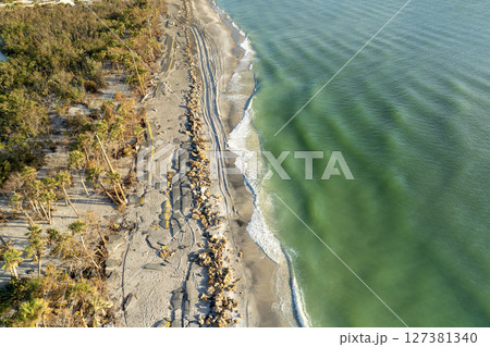 Storm surge destroyed oceanfront road on Gulf coast after hurricane in Florida. Severe damage to transportation infrastructure 127381340