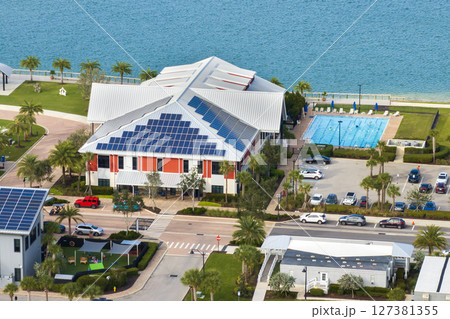 Solar photovoltaic panels installed on top of Florida office building for producing clean ecological electric energy. Renewable electricity with zero emission concept 127381355