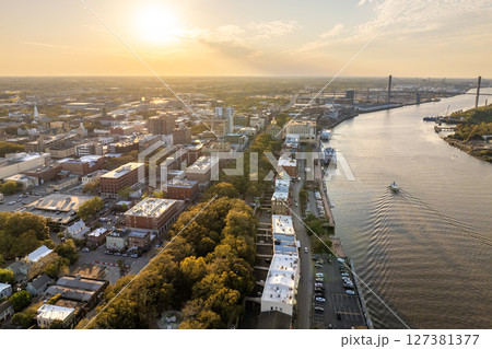 Savannah, Georgia. Old historic River Street architecture. View from above of illuminated streets at night. USA tourist attraction Savannah, Georgia. Old historic River Street architecture. View from above of illuminated streets at night. USA tourist attraction 127381377