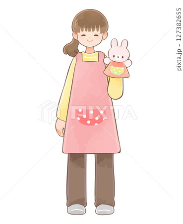 うさぎのパペットを持った保育士の女性　長袖 127382655